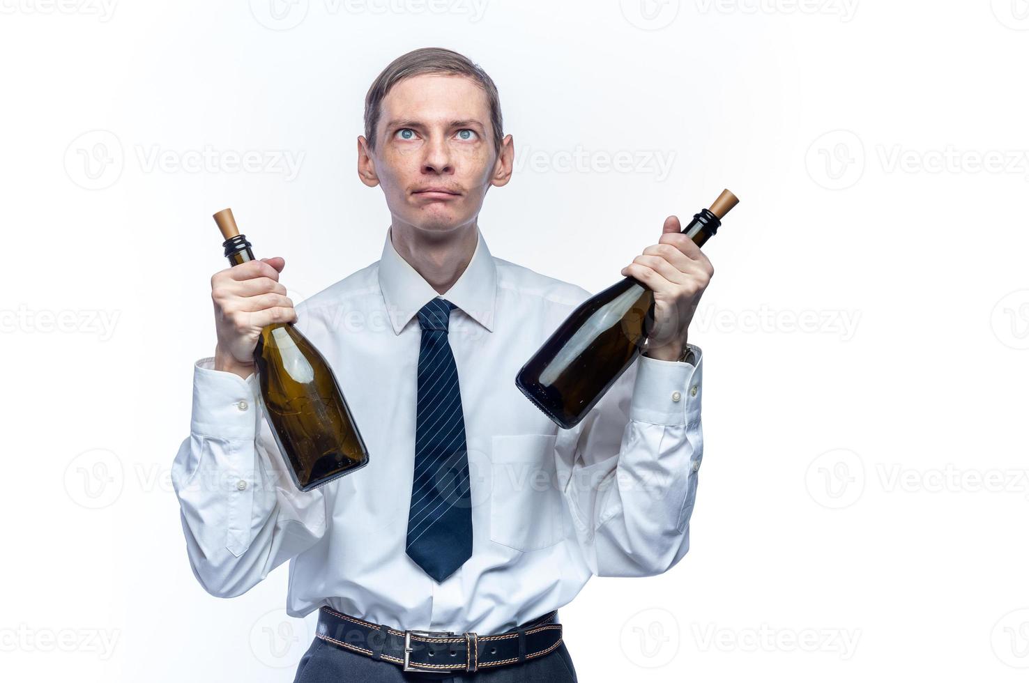 Business man with a bottle of wine in his hands on a white, isolated background photo