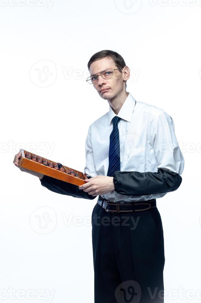 Business man in tie and glasses with bills in hand on white, isolated background photo