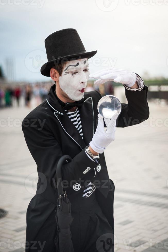 Mime on the street waiting to meet with his lover photo