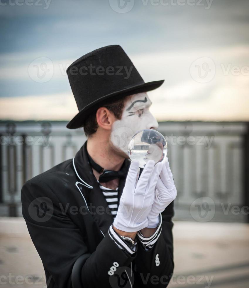 Mime on the street waiting to meet with his lover photo