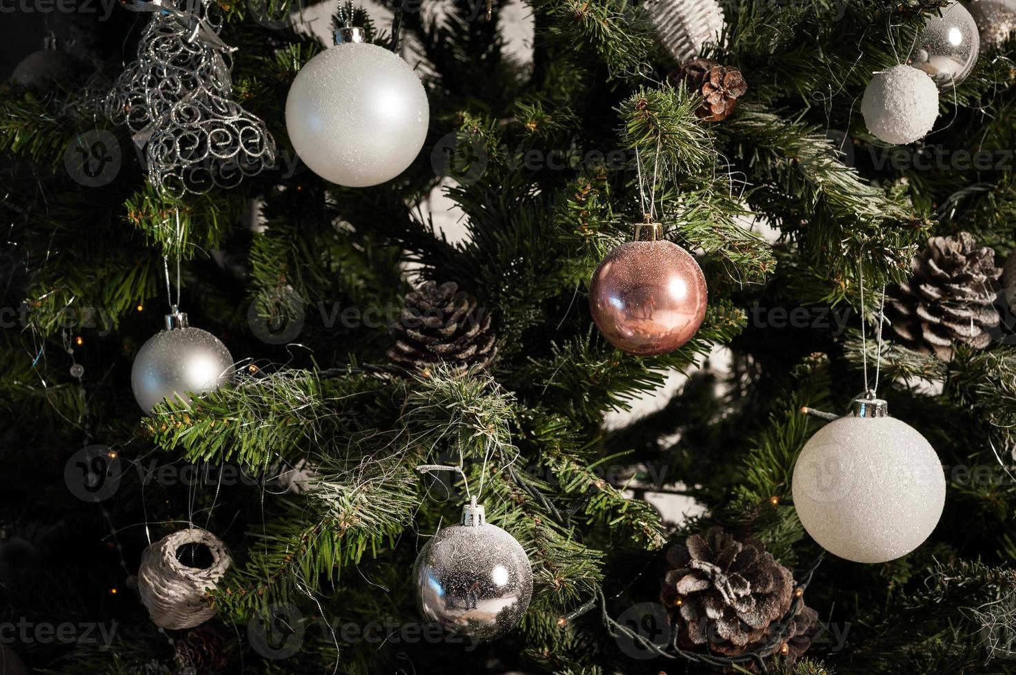 close up of christmas tree decorated with balls photo