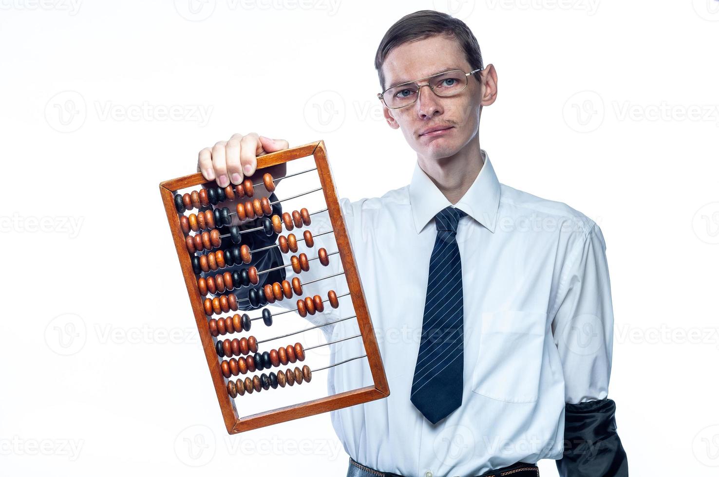 Business man in tie and glasses with bills in hand on white, isolated background photo