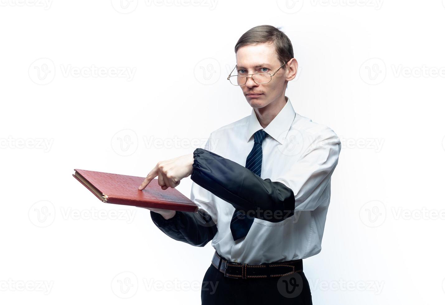 A business man in a tie and glasses with a magazine in his hands on a white, isolated background photo