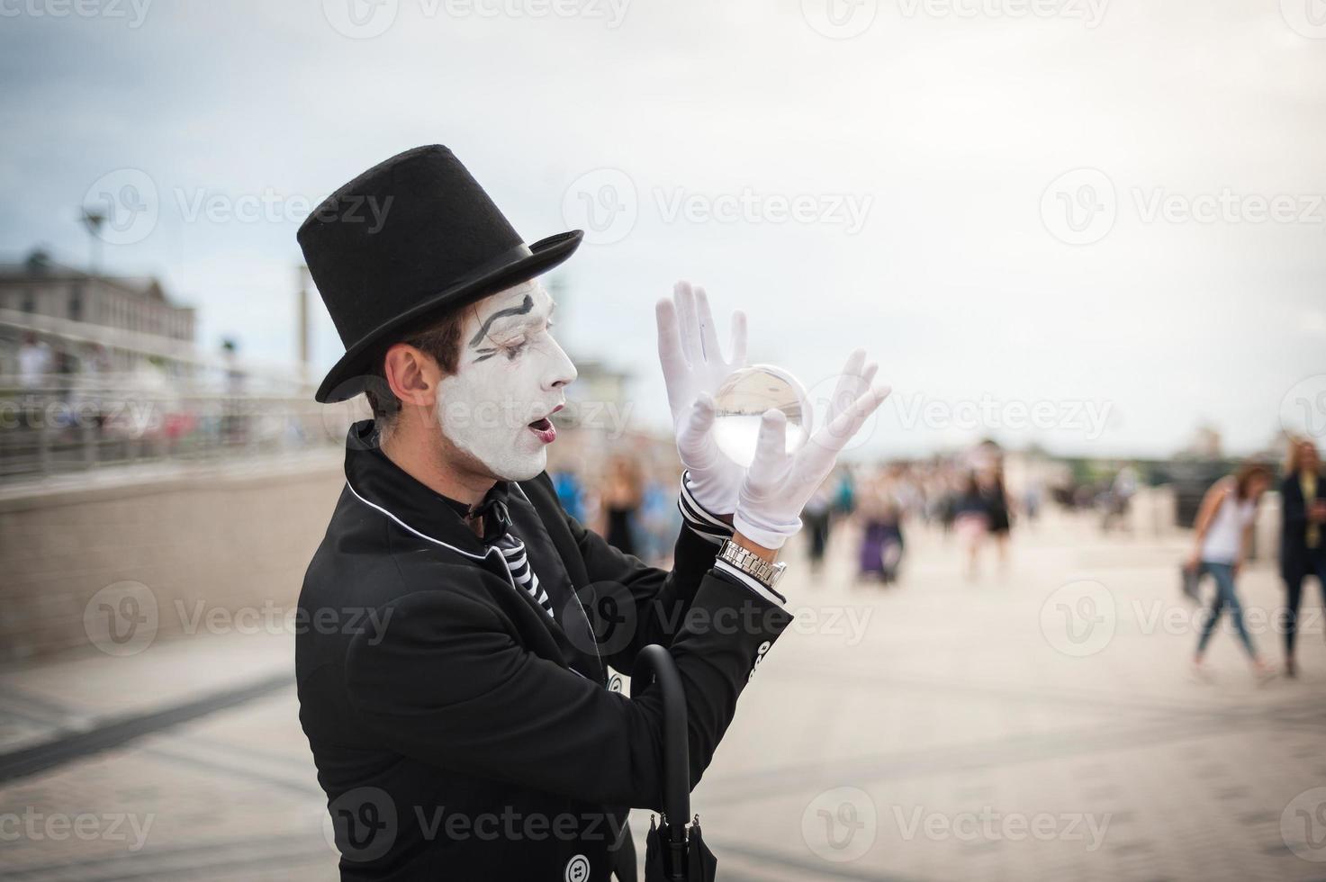 Mime on the street waiting to meet with his lover photo