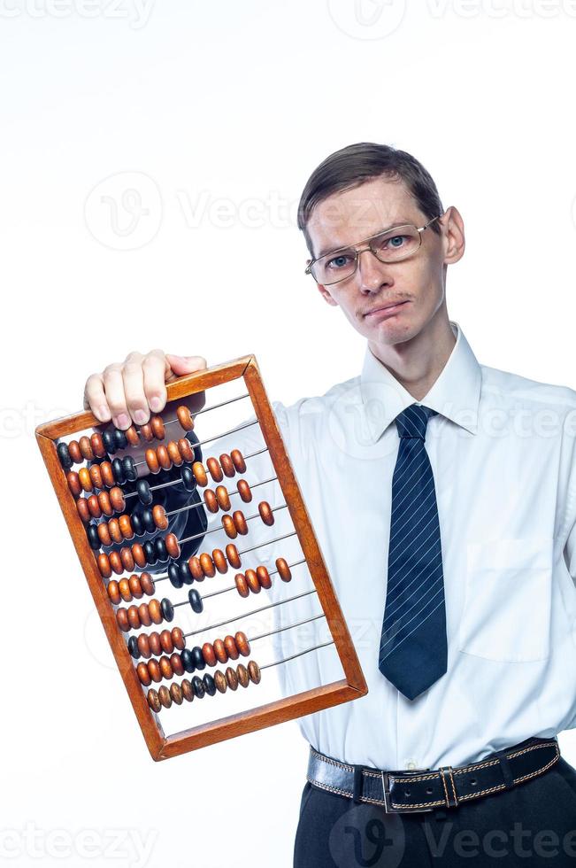 Business man in tie and glasses with bills in hand on white, isolated background photo