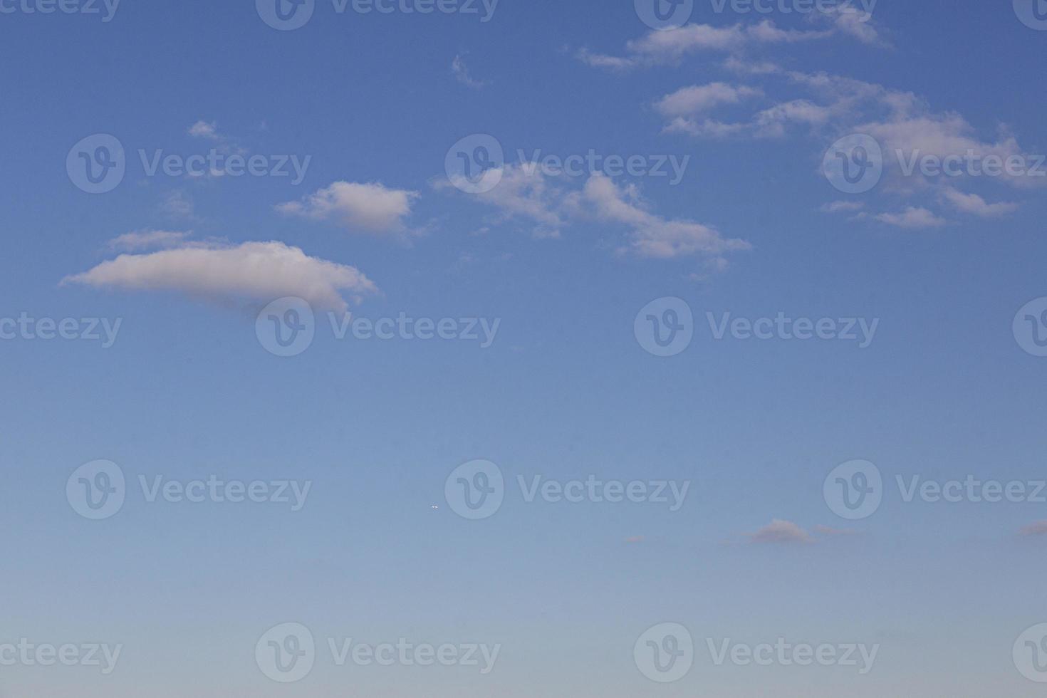Image of a partly cloudy and partly clear sky during the day photo