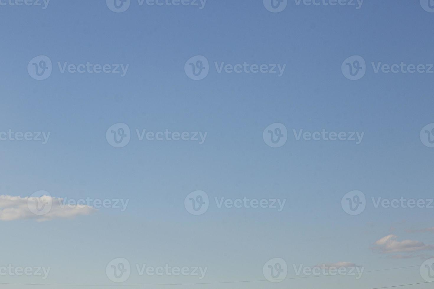 Image of a partly cloudy and partly clear sky during the day photo