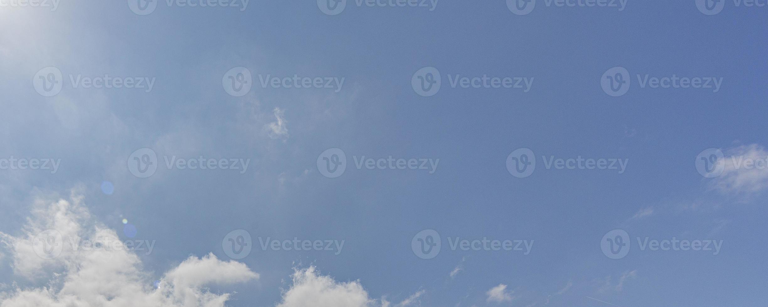 Image of a partly cloudy and partly clear sky during the day photo