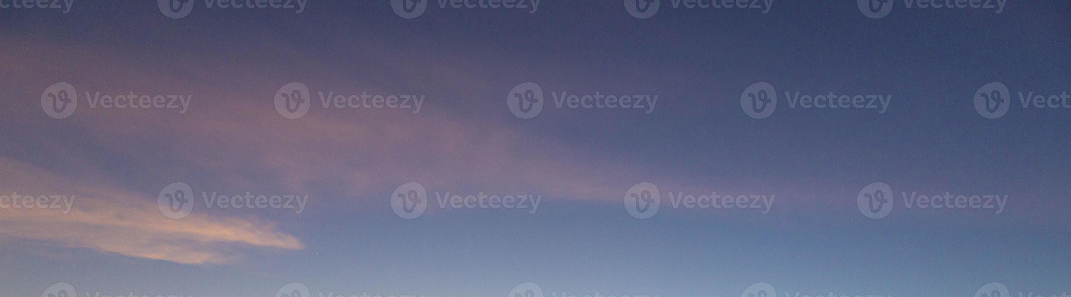 Dramatic colorful sky with afterglow and illuminated clouds photo