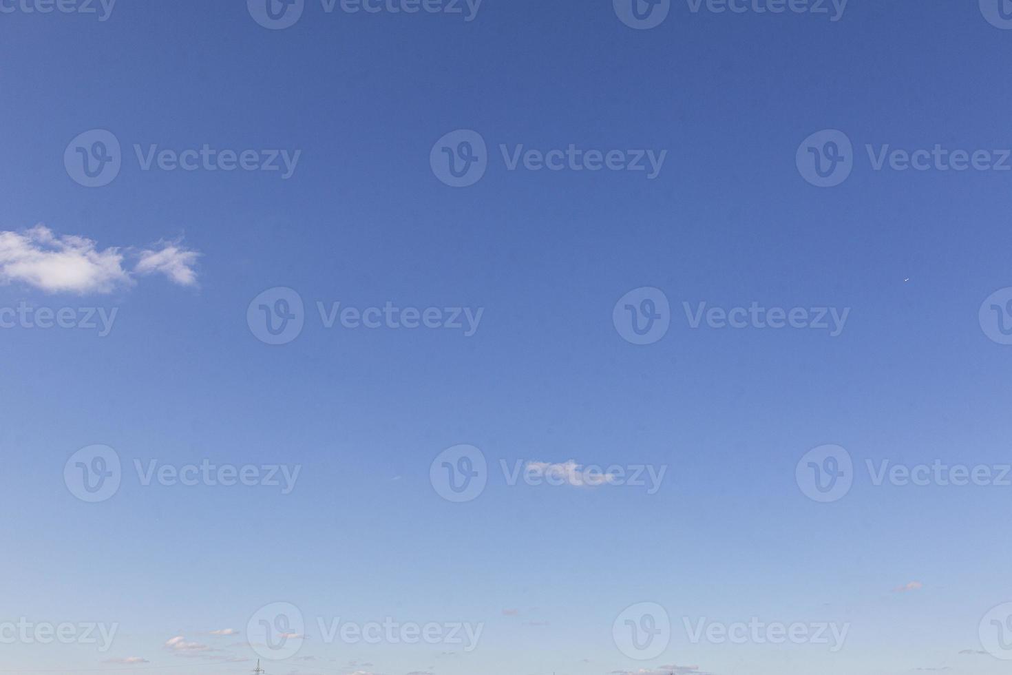 Image of a partly cloudy and partly clear sky during the day photo
