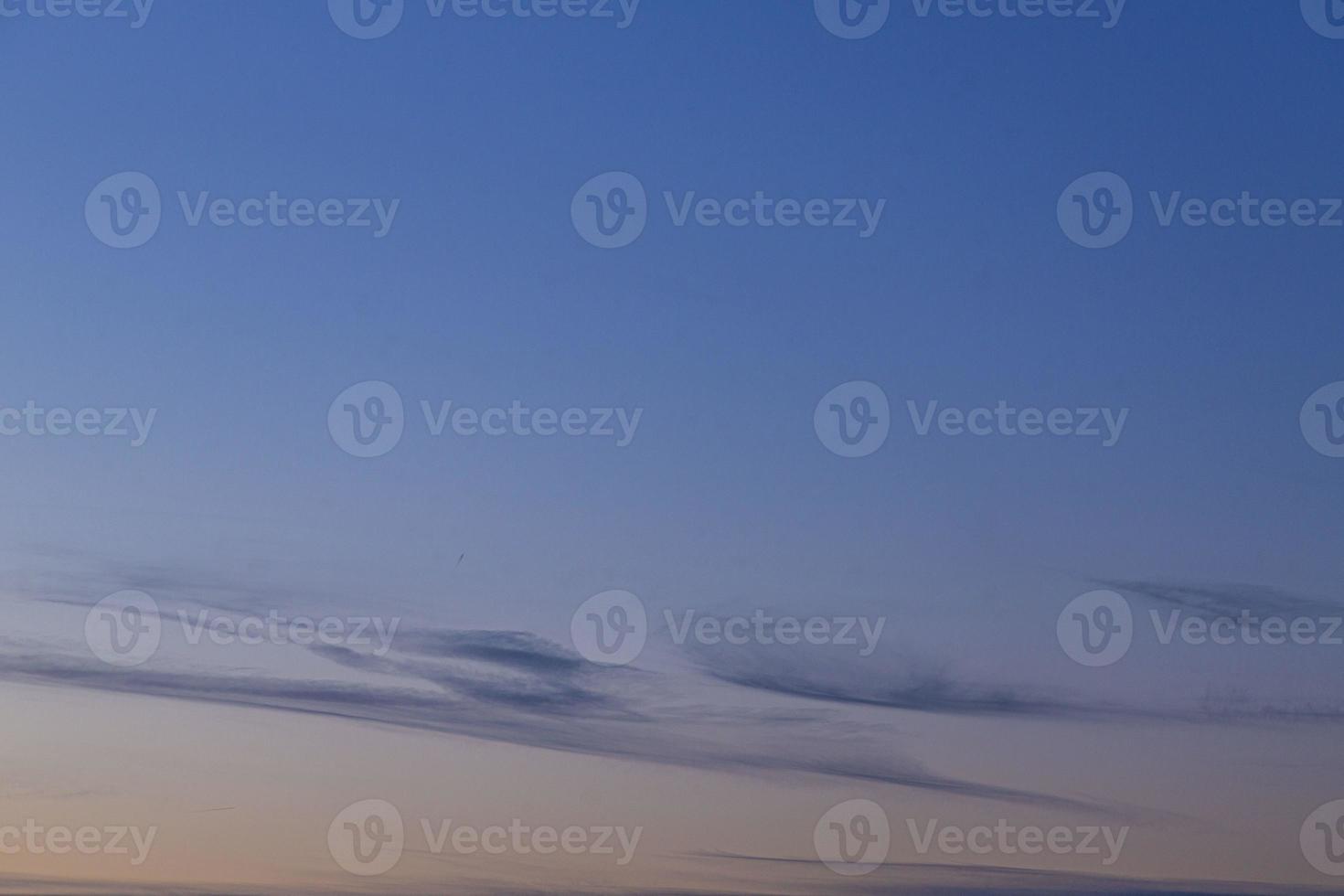 Dramatic colorful sky with afterglow and illuminated clouds photo