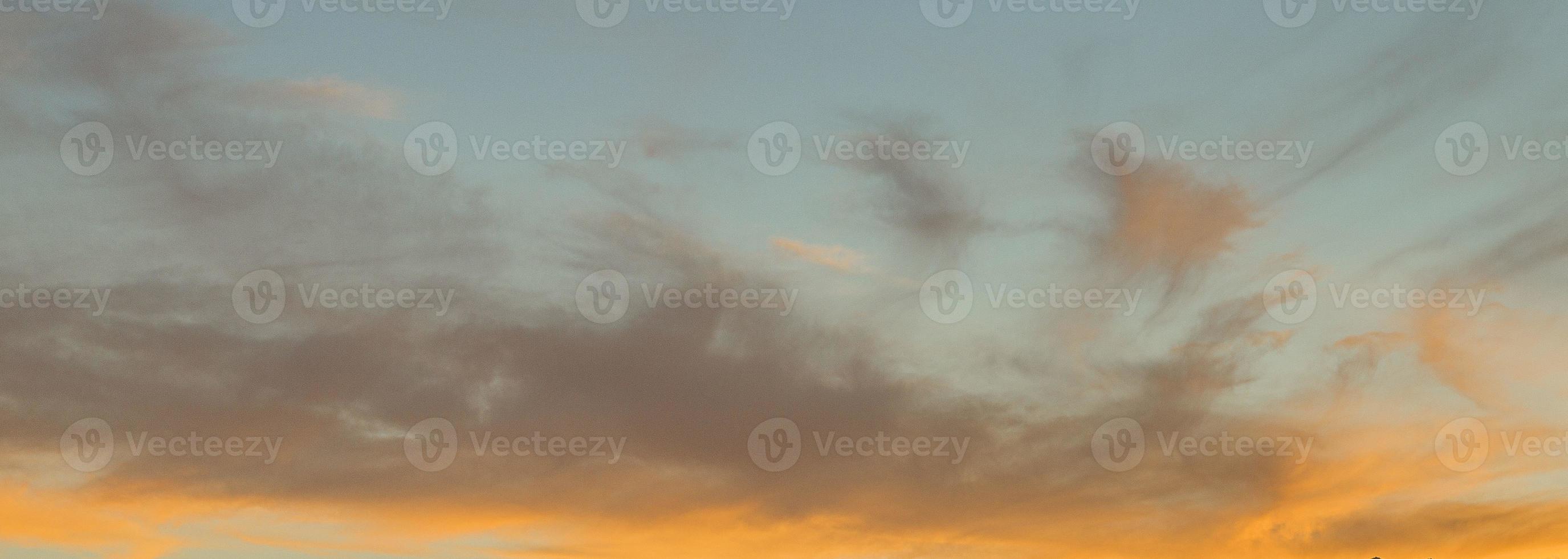 Dramatic colorful sky with afterglow and illuminated clouds photo