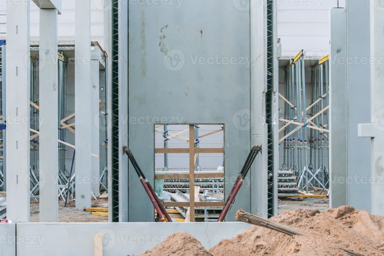 Precast concrete elements on construction site during installation process photo