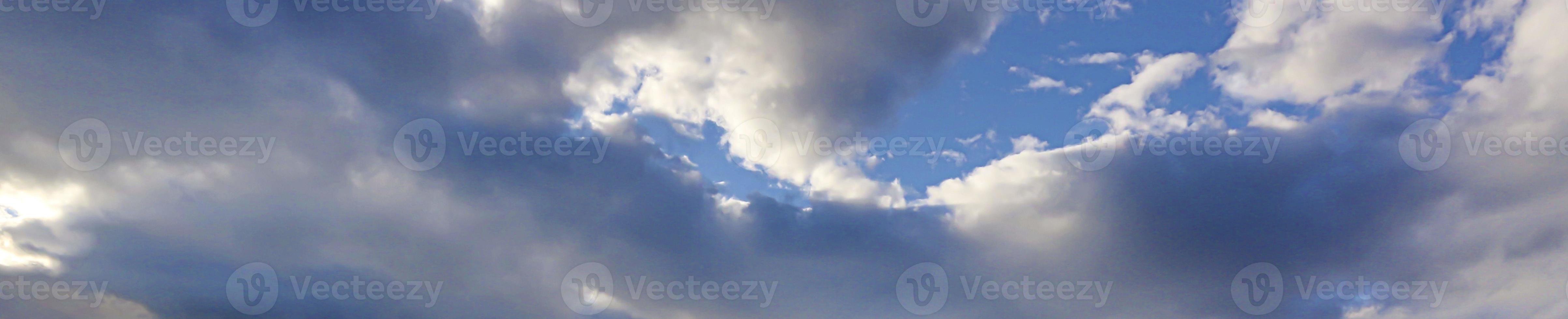 Image of a partly cloudy and partly clear sky during the day photo