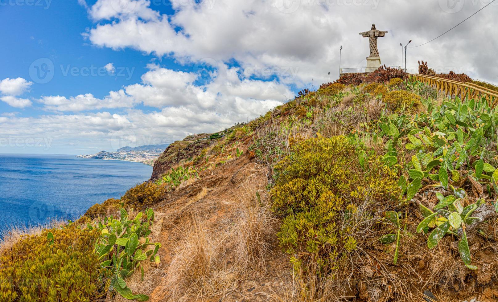 Panoramic view on famous statue of Christ near Funchal on the island of Madeira in summer photo