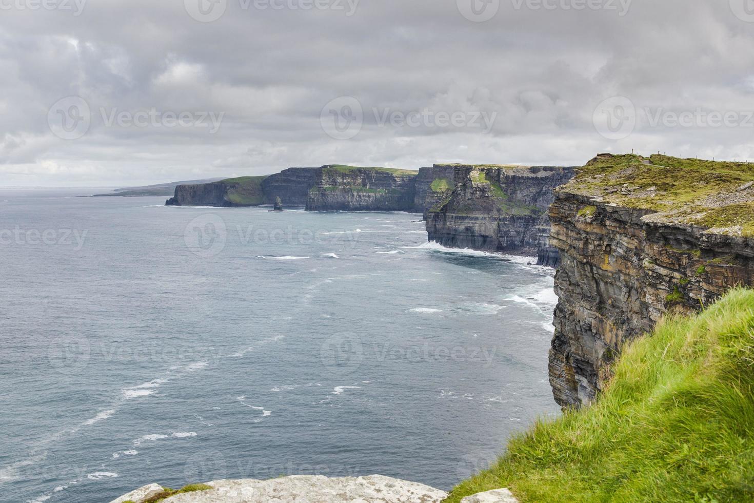 View over cliff line of the Cliffs of Moher in Ireland during daytime photo