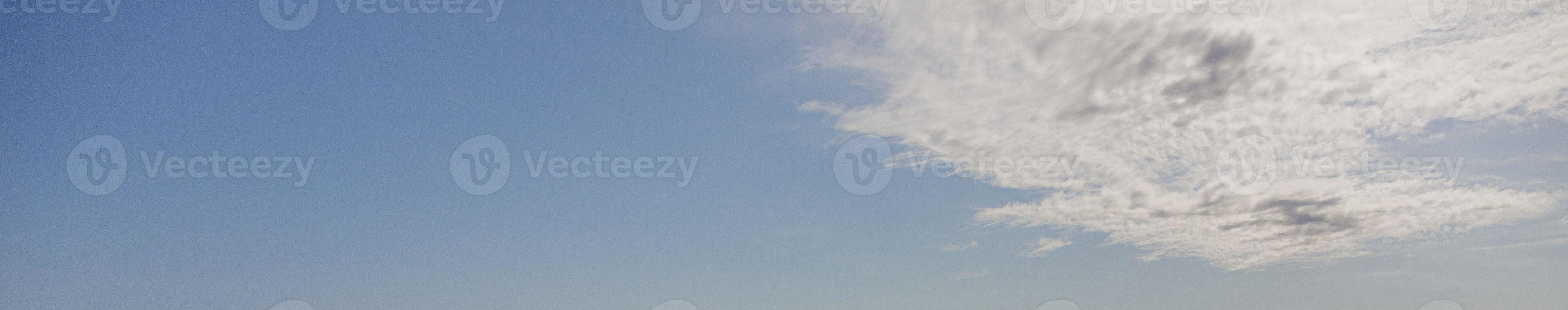 Image of a partly cloudy and partly clear sky during the day photo