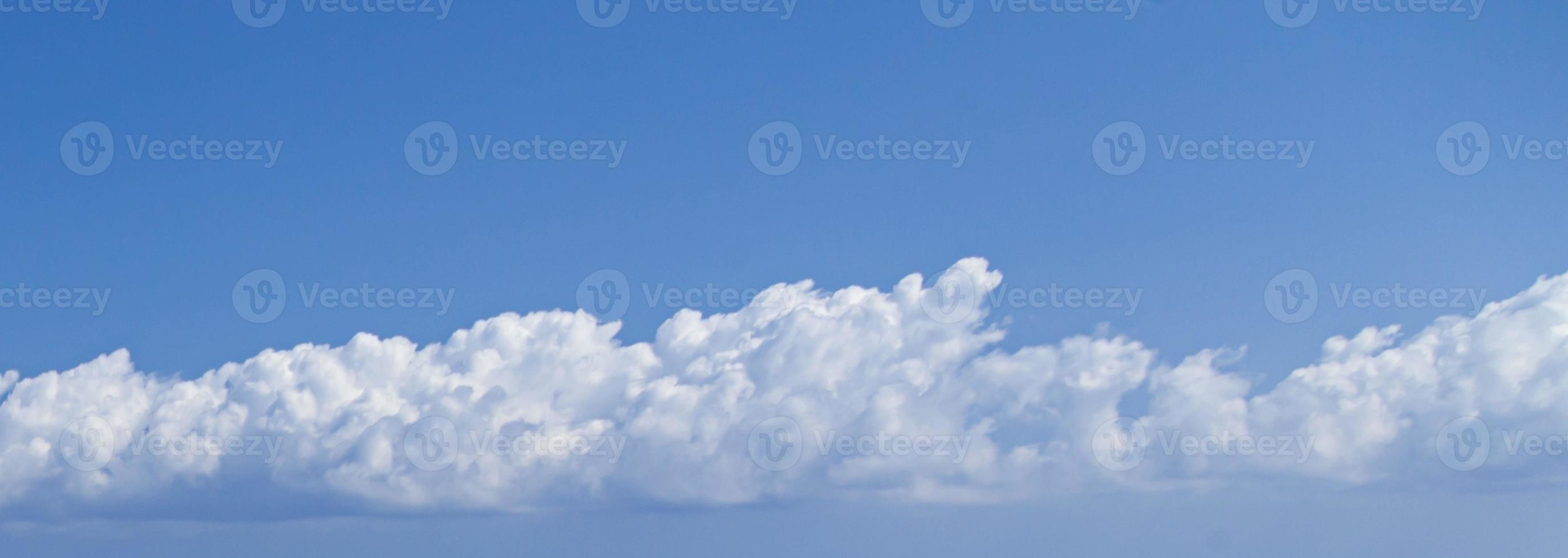 Image of a partly cloudy and partly clear sky during the day photo