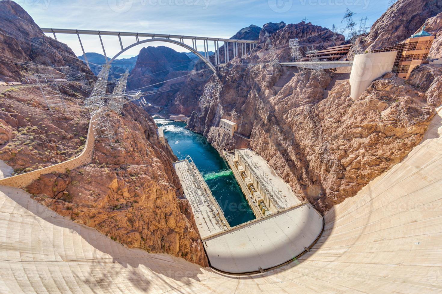 View from Hoover Dam over Colorado river with Mike O Callaghan Pat Tillman Memorial Bridge in the evening photo