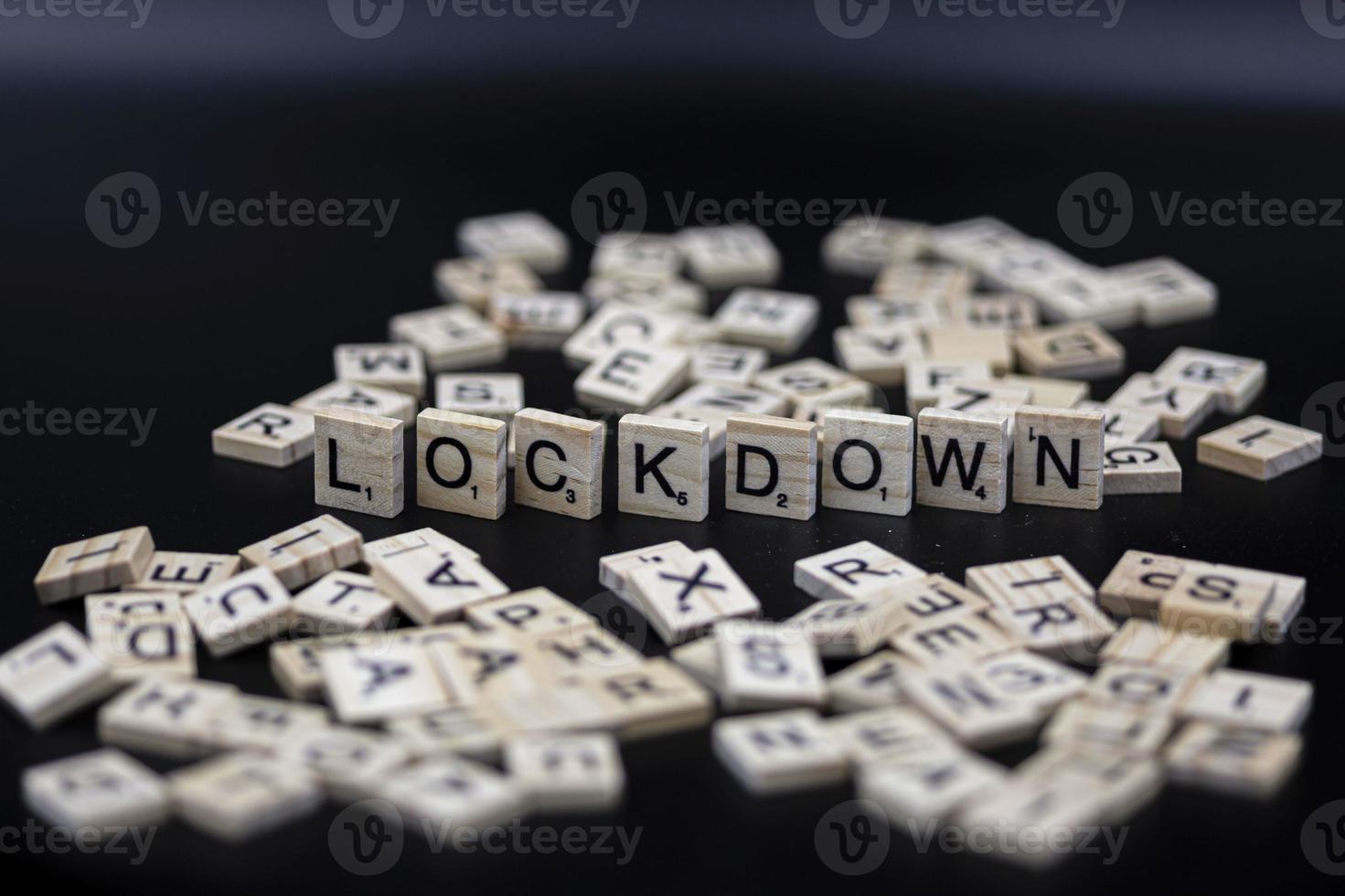 Lock down - Covid-19 - symbolic letters - dark background photo