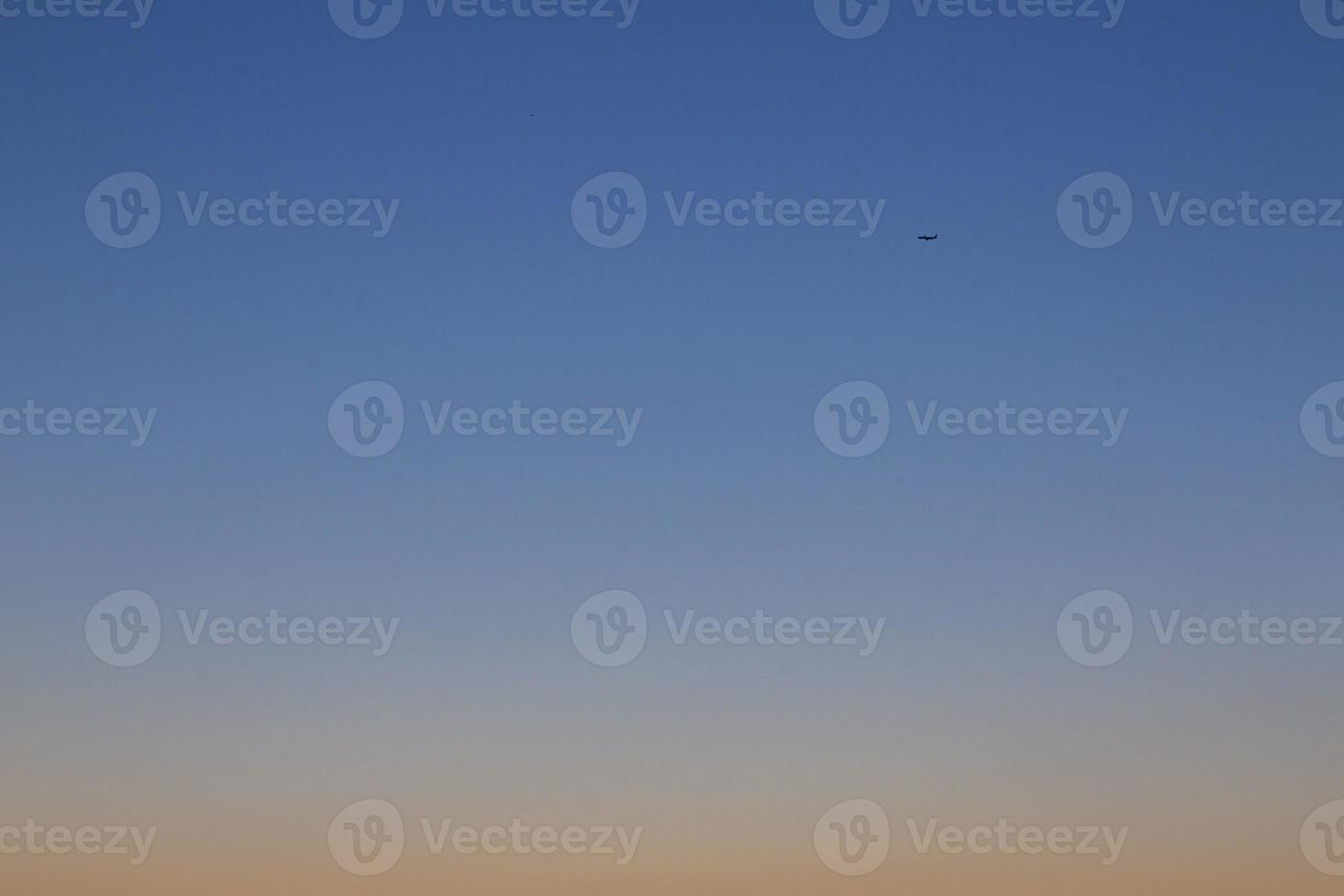Dramatic colorful sky with afterglow and illuminated clouds photo