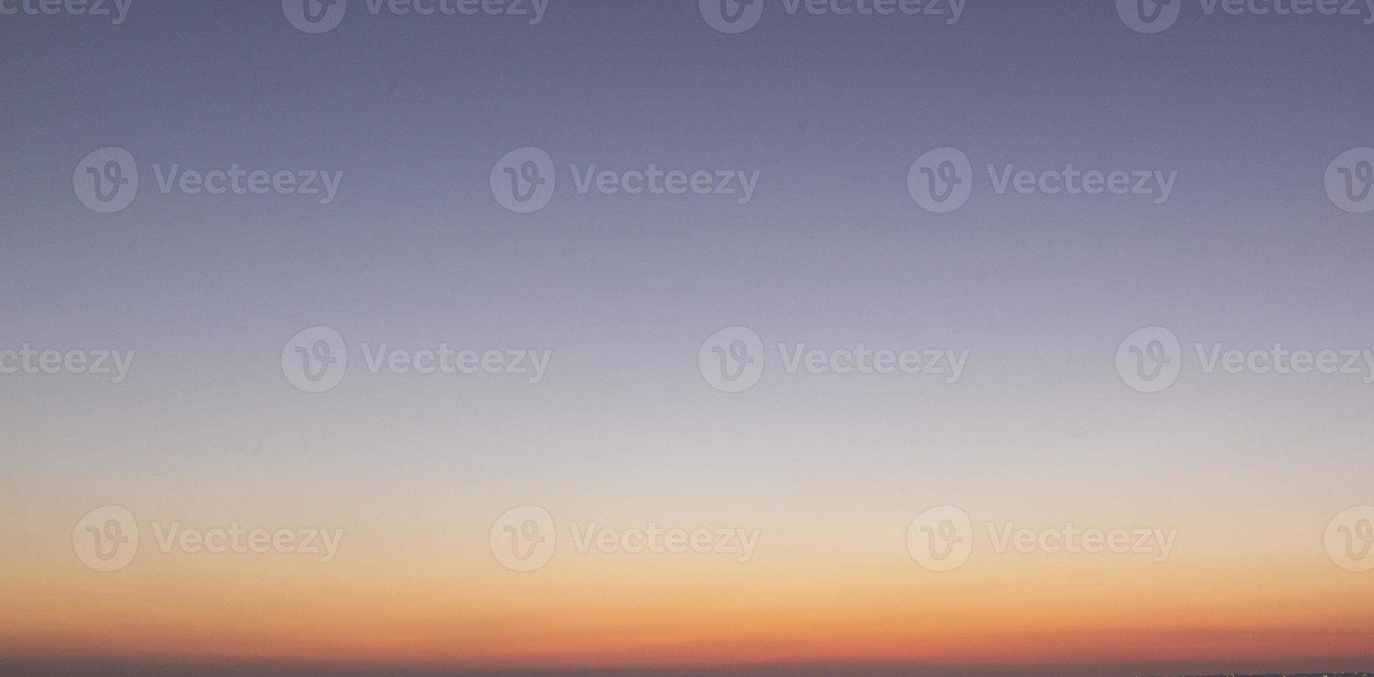 Dramatic colorful sky with afterglow and illuminated clouds photo