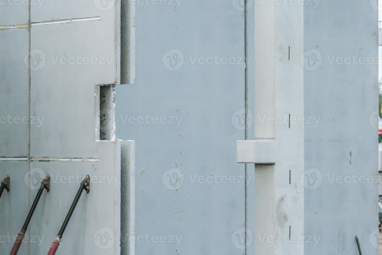 Precast concrete elements on a construction site durung installation process photo