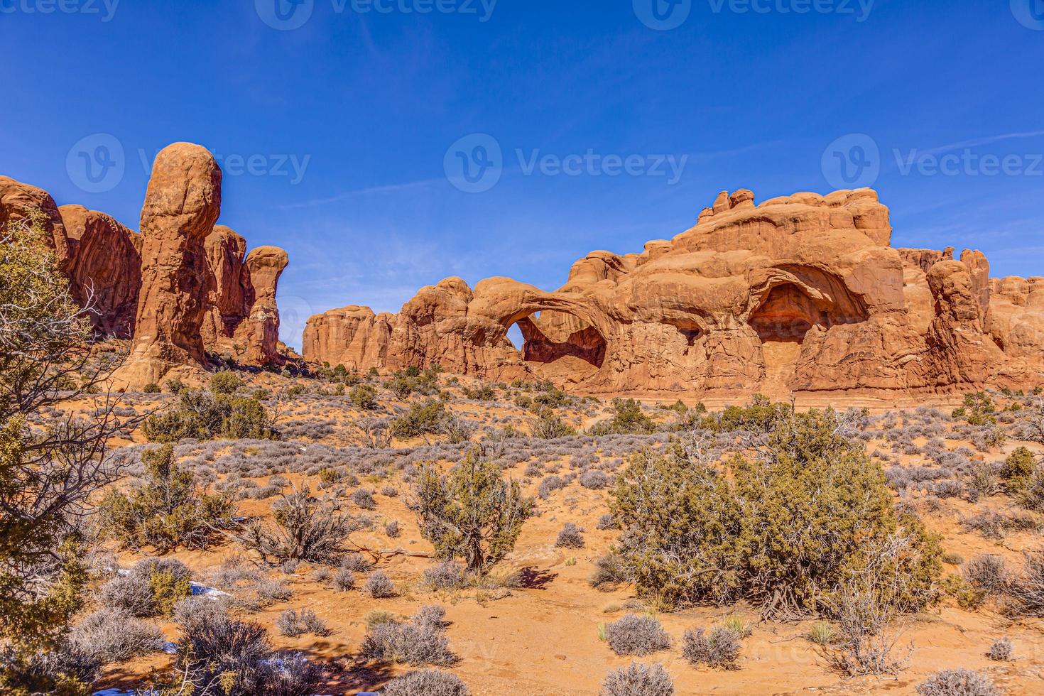 Panoramic picture of natural and geological wonders of Arches national park in Utah in winter photo