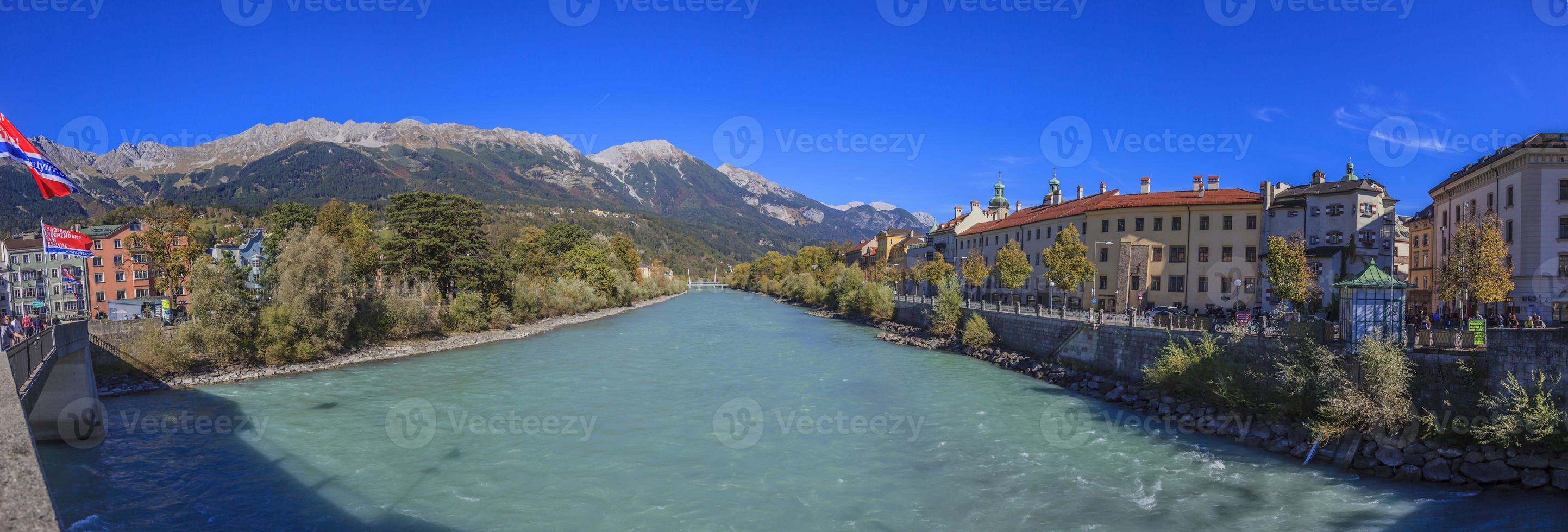 Panoramic view over the Inn river from the Inn bridge in Innsbruck photo