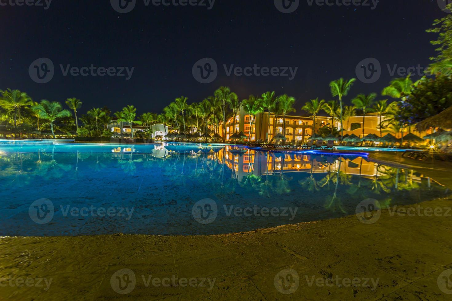 View over a tropic pool area at night photo