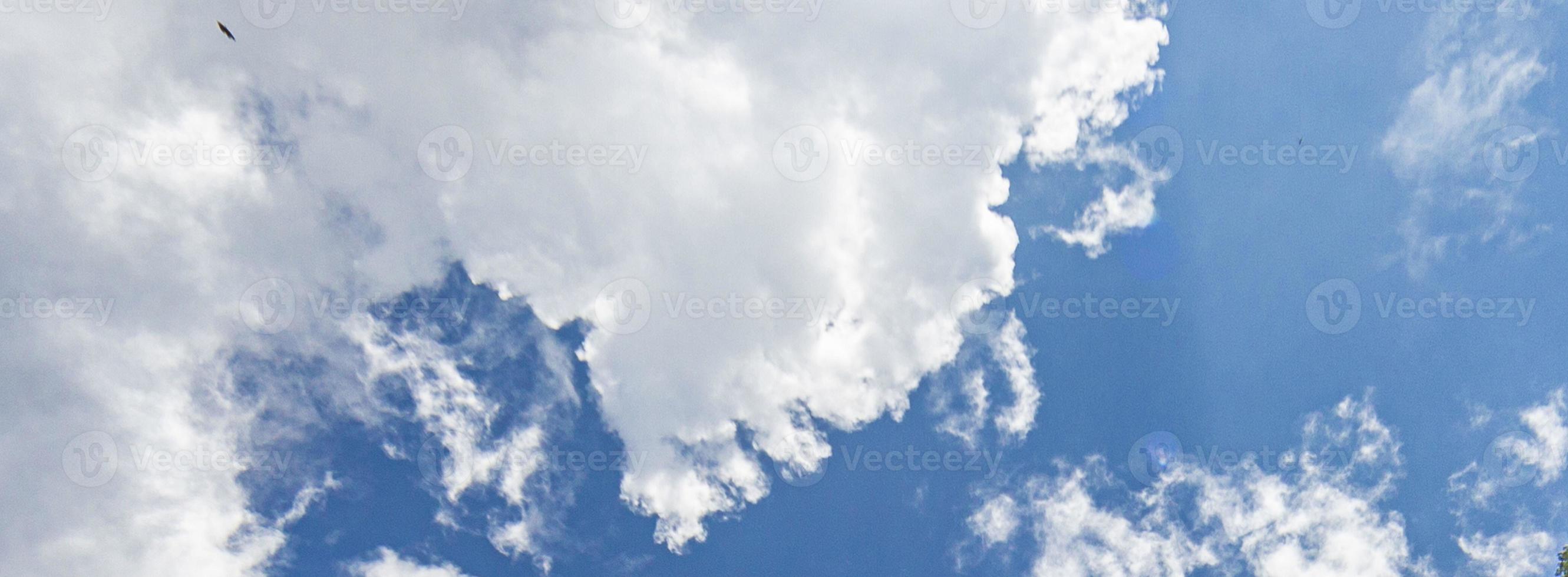 Image of a partly cloudy and partly clear sky during the day photo