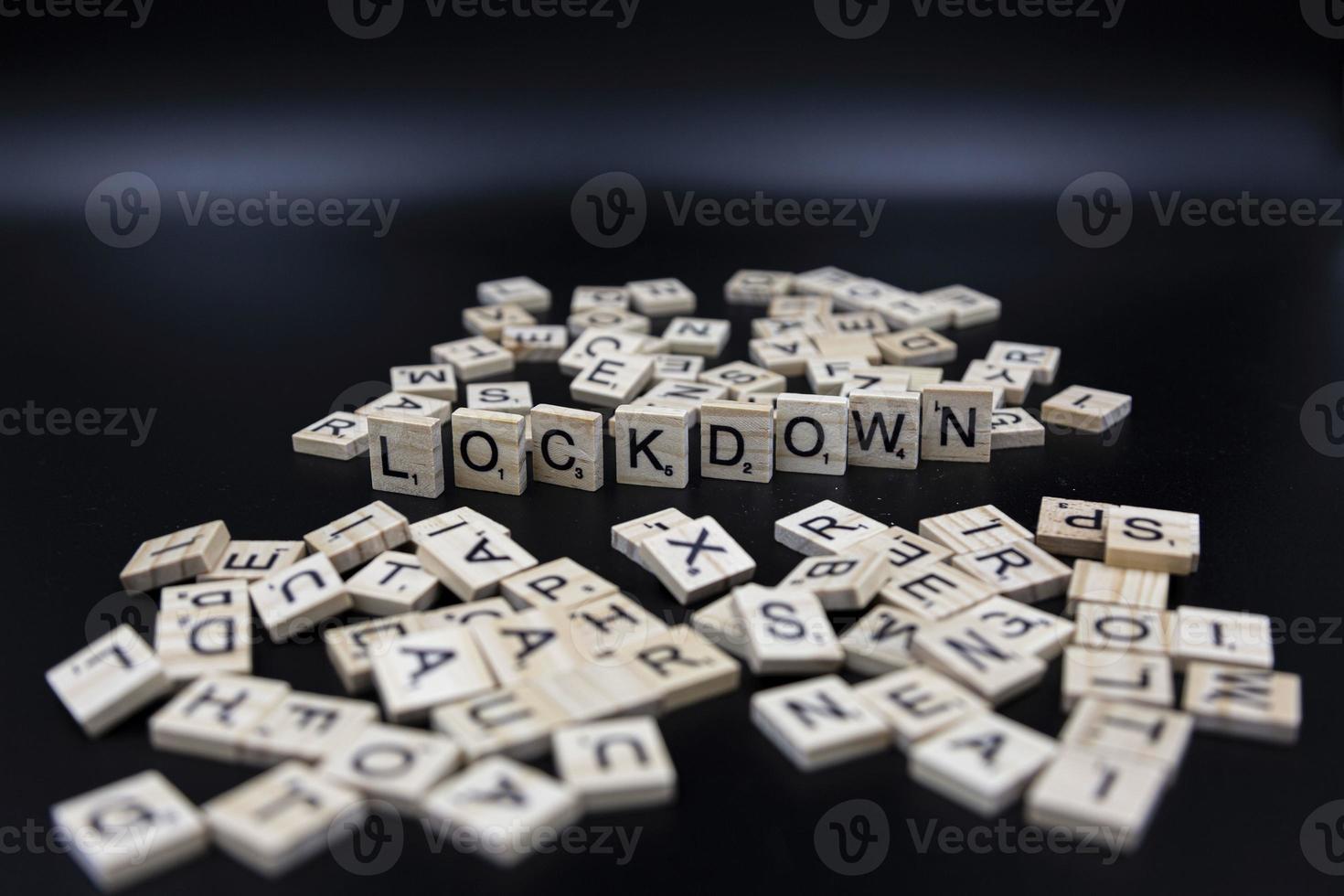Lock down - Covid-19 - symbolic letters - dark background photo