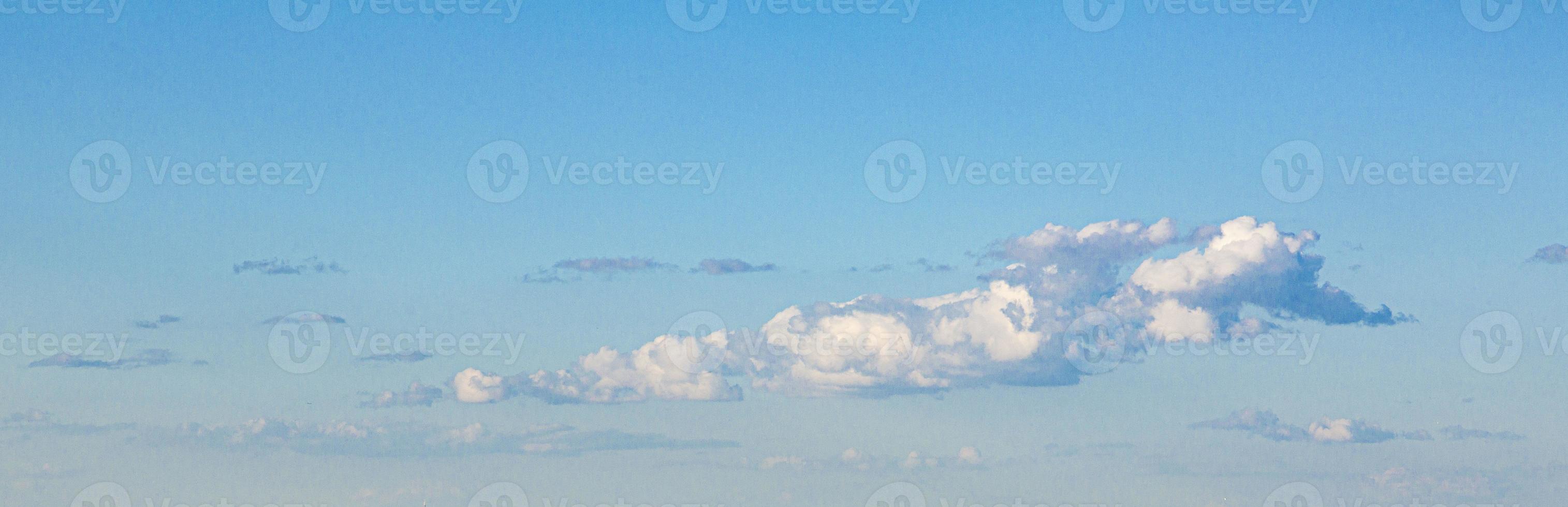 Image of a partly cloudy and partly clear sky during the day photo