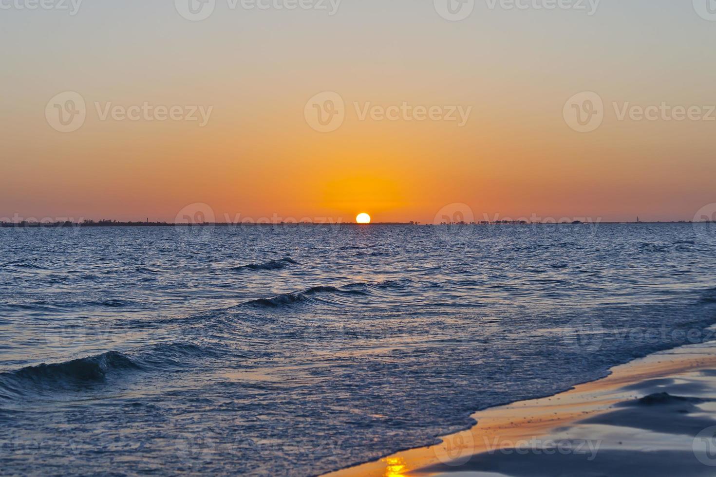 Sunset over sea with deserted beach in Florida photo