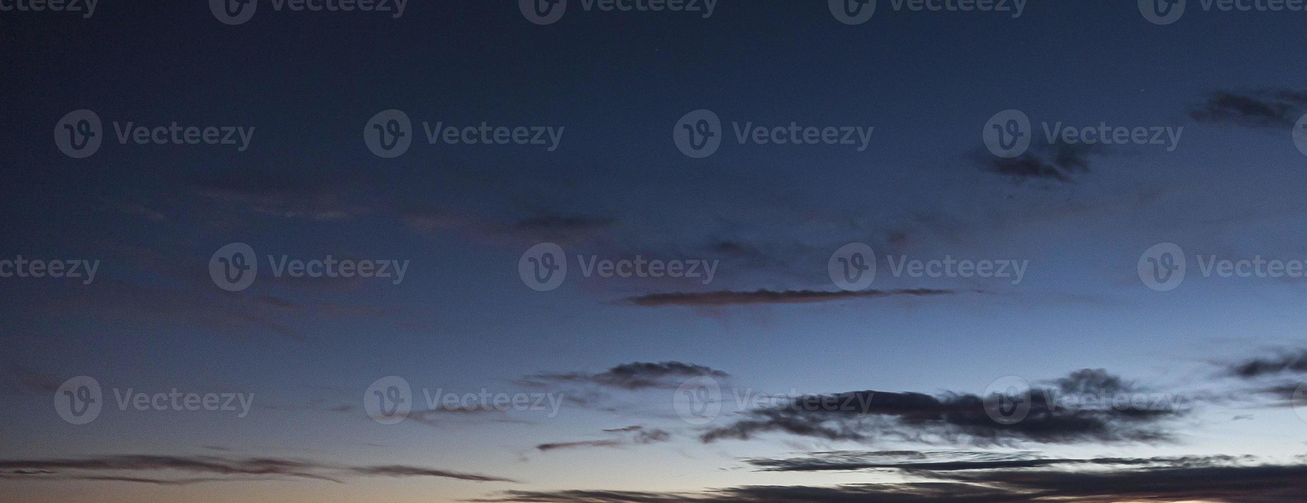 Dramatic colorful sky with afterglow and illuminated clouds photo