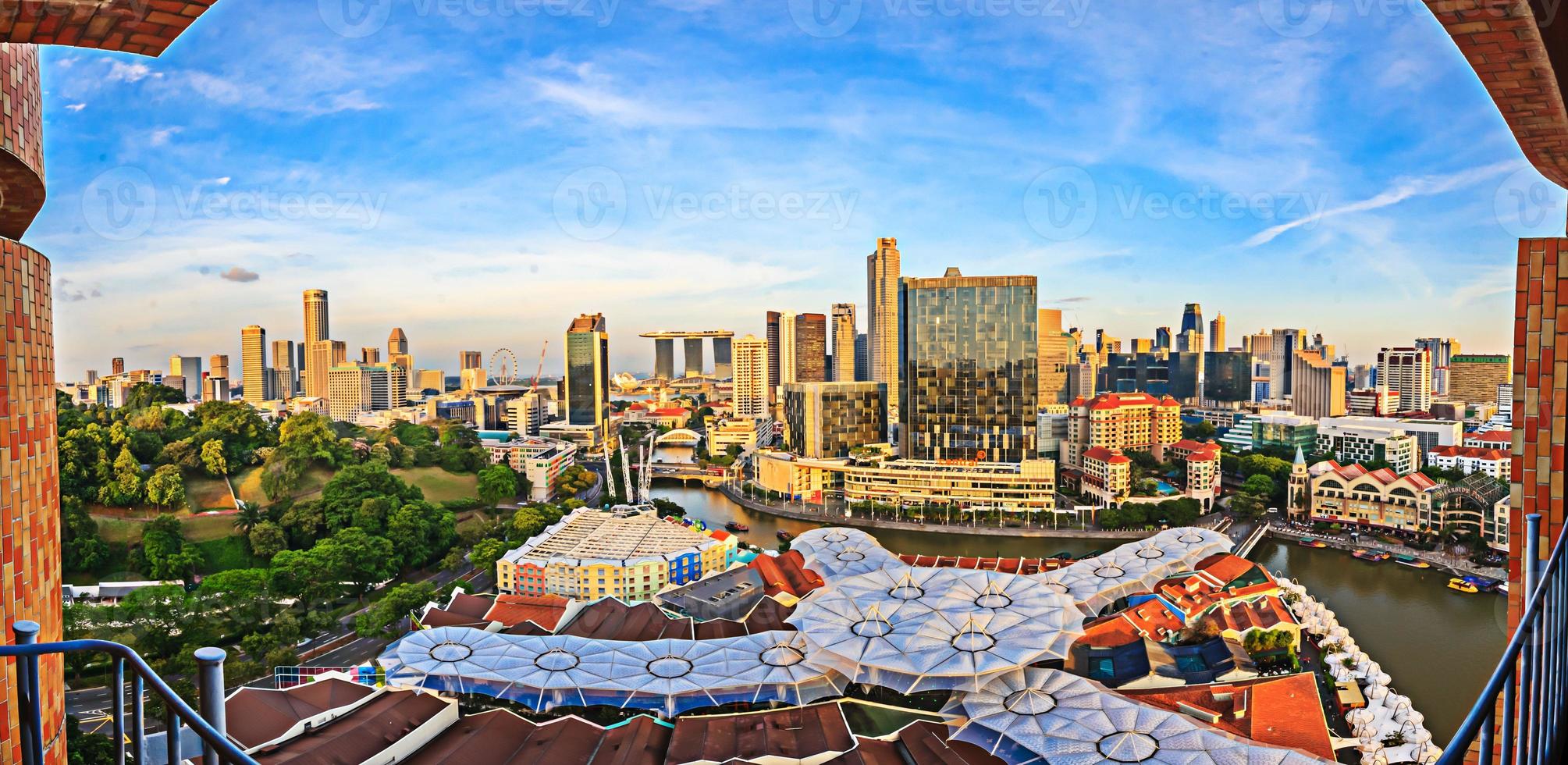 Panoramic view over the Singapore skyline at sunset photo