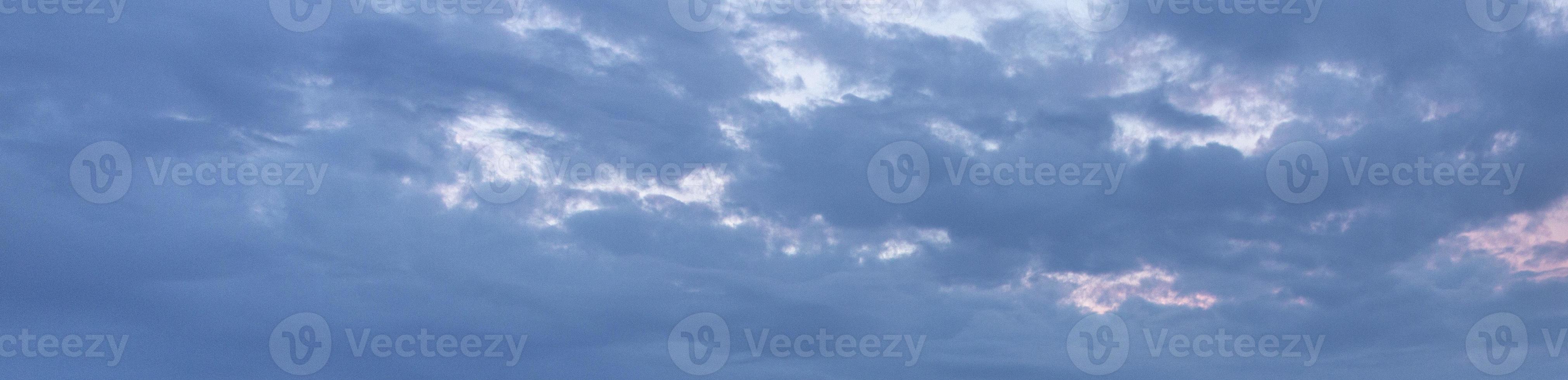 Image of a partly cloudy and partly clear sky during the day photo
