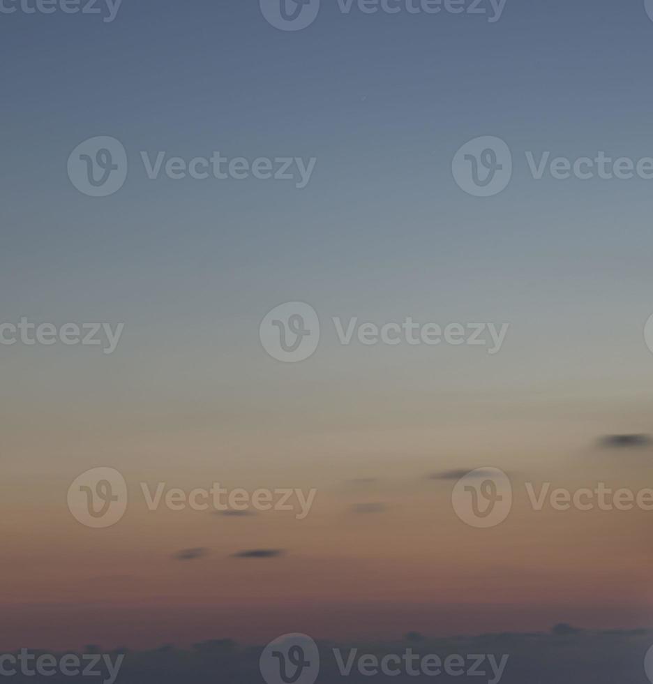 Dramatic colorful sky with afterglow and illuminated clouds photo