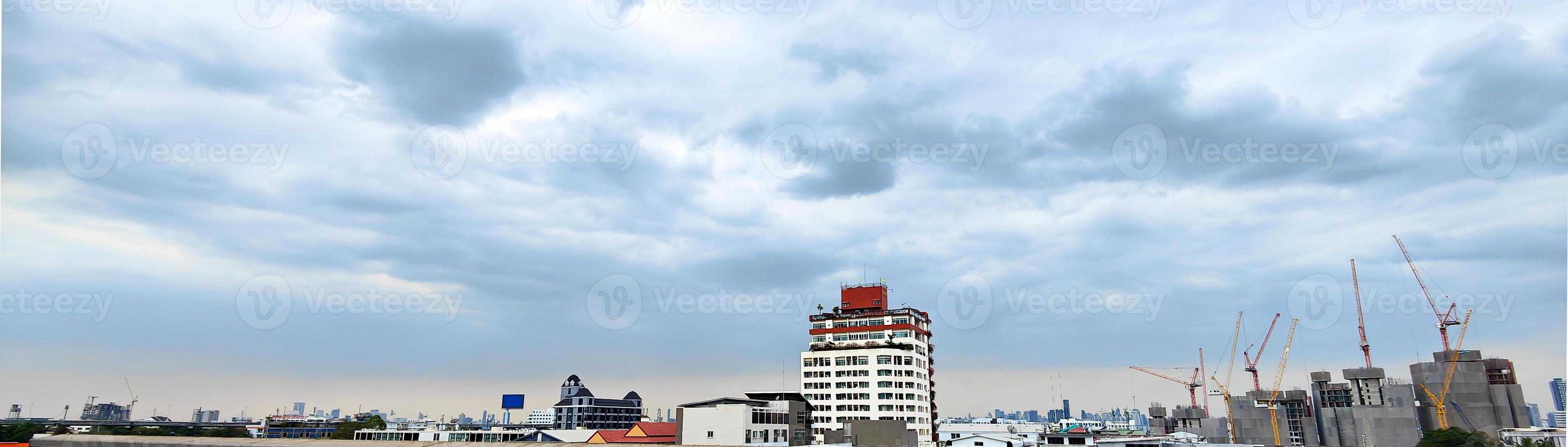 Horizontal banner of large city buildings with sky. photo