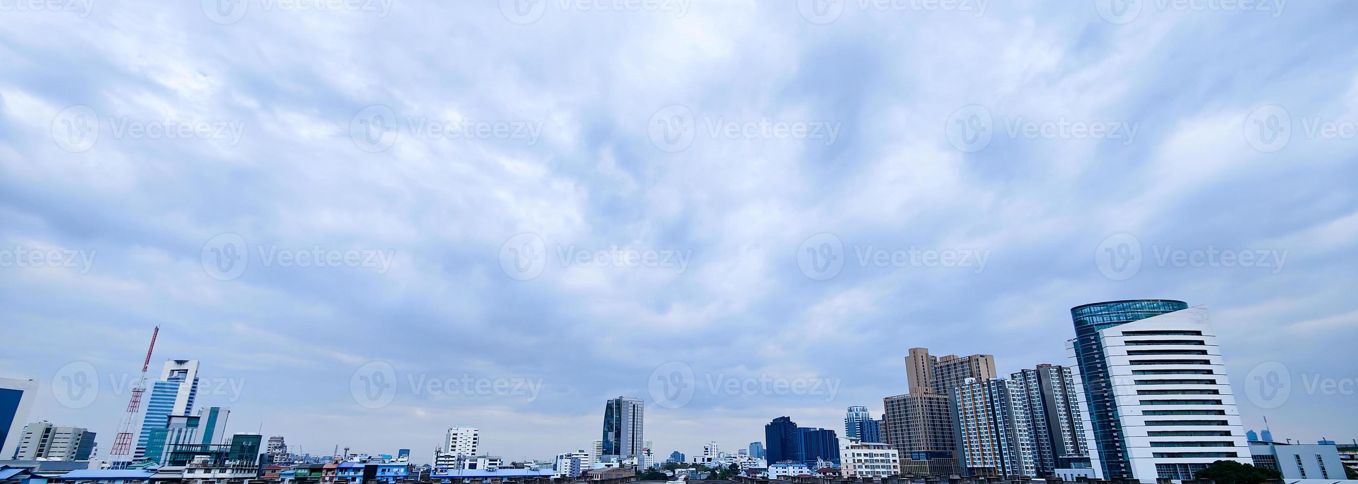 Horizontal banner of large city buildings with sky. photo