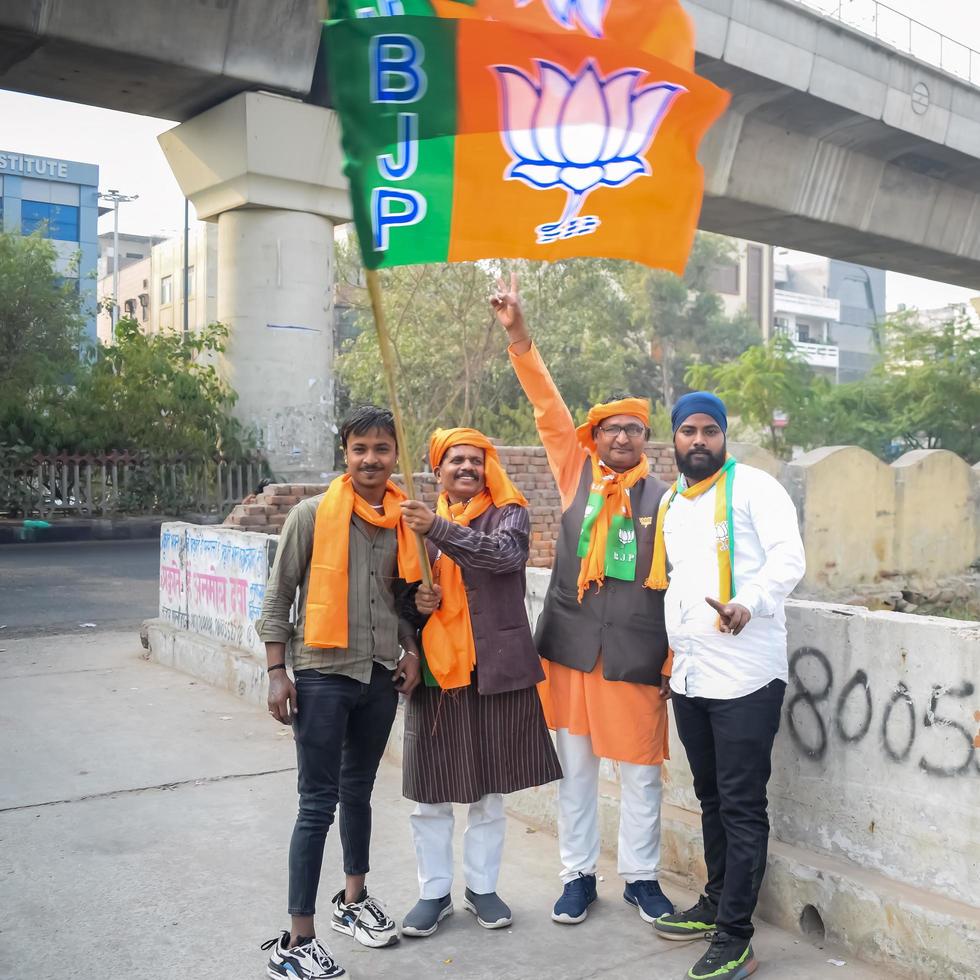 Delhi, India, December 02 2022  - Bharatiya Janata Party BJP supporter during mega road show in support of BJP candidate Pankaj Luthara to file nomination papers ahead of MCD local body Elections 2022 photo