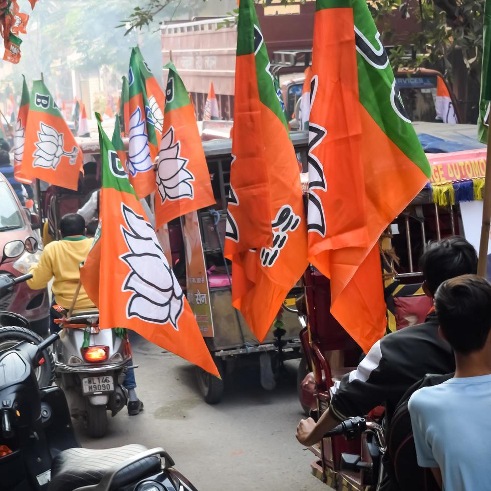 Delhi, India, December 02 2022 -Bharatiya Janata Party BJP supporter during mega road show in support of BJP candidate Pankaj Luthara to file nomination papers ahead of MCD local body Elections 2022 photo