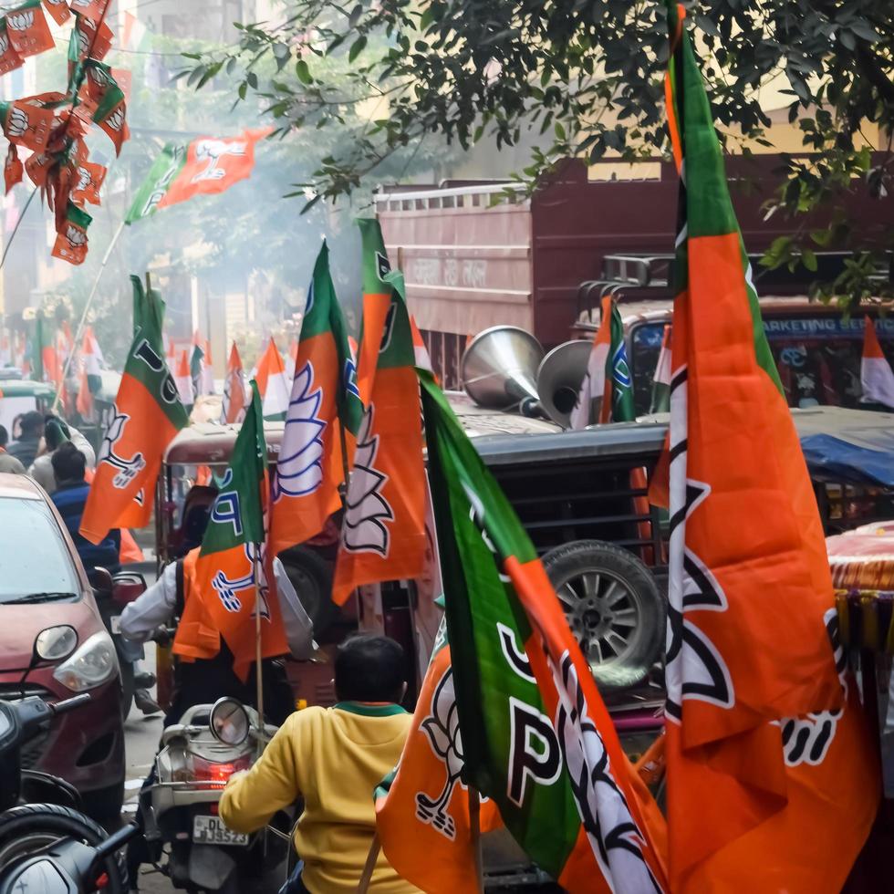 Delhi, India, December 02 2022 -Bharatiya Janata Party BJP supporter during mega road show in support of BJP candidate Pankaj Luthara to file nomination papers ahead of MCD local body Elections 2022 photo