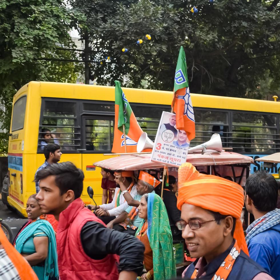 Delhi, India, December 02 2022 -Bharatiya Janata Party BJP supporter during mega road show in support of BJP candidate Pankaj Luthara to file nomination papers ahead of MCD local body Elections 2022 photo