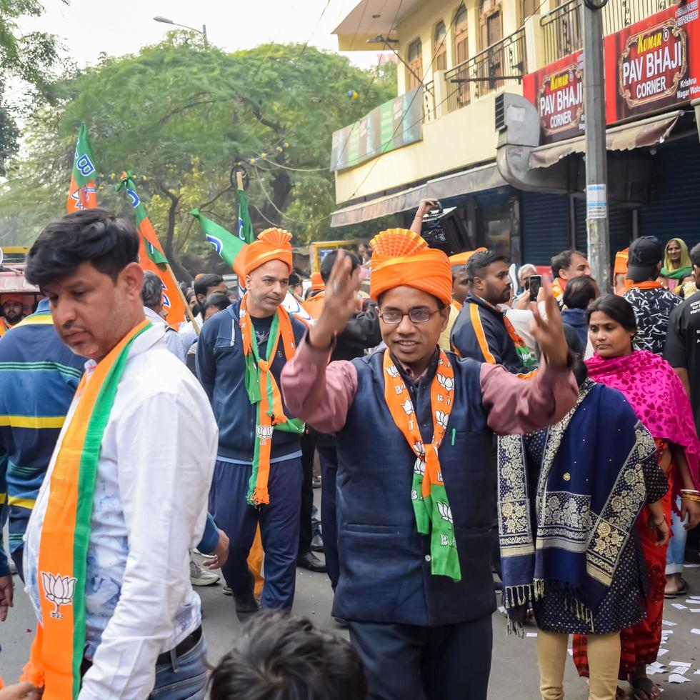 Delhi, India, December 02 2022 -Bharatiya Janata Party BJP supporter during mega road show in support of BJP candidate Pankaj Luthara to file nomination papers ahead of MCD local body Elections 2022 photo