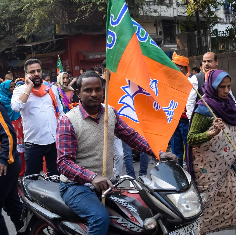 Delhi, India, December 02 2022 -Bharatiya Janata Party BJP supporter during mega road show in support of BJP candidate Pankaj Luthara to file nomination papers ahead of MCD local body Elections 2022 photo