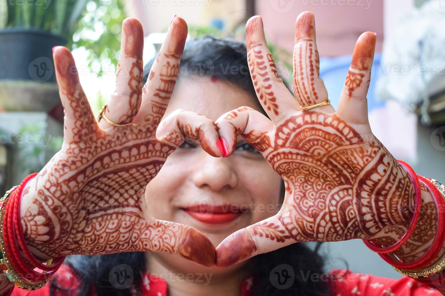 Beautiful woman dressed up as Indian tradition with henna mehndi design on her both hands to celebrate big festival of Karwa Chauth, Karwa Chauth celebrations by Indian woman for her husband photo