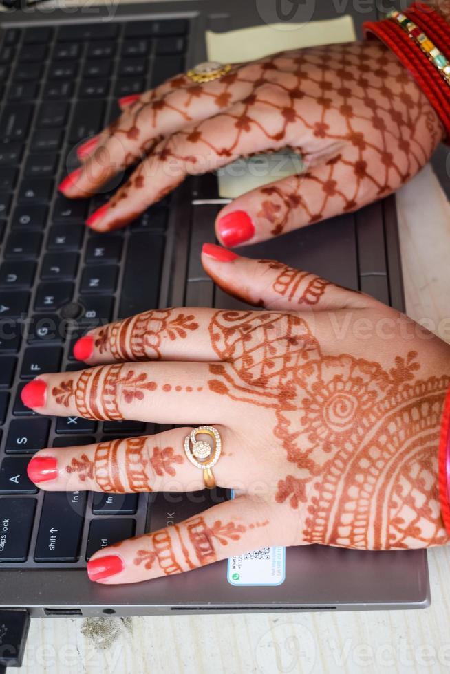 Beautiful woman dressed up as Indian tradition with henna mehndi design on her both hands to celebrate big festival of Karwa Chauth, Karwa Chauth celebrations by Indian woman for her husband photo