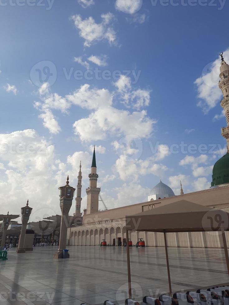 Beautiful daytime view of Masjid Al Nabawi, Medina's green dome, minarets and mosque courtyard. photo