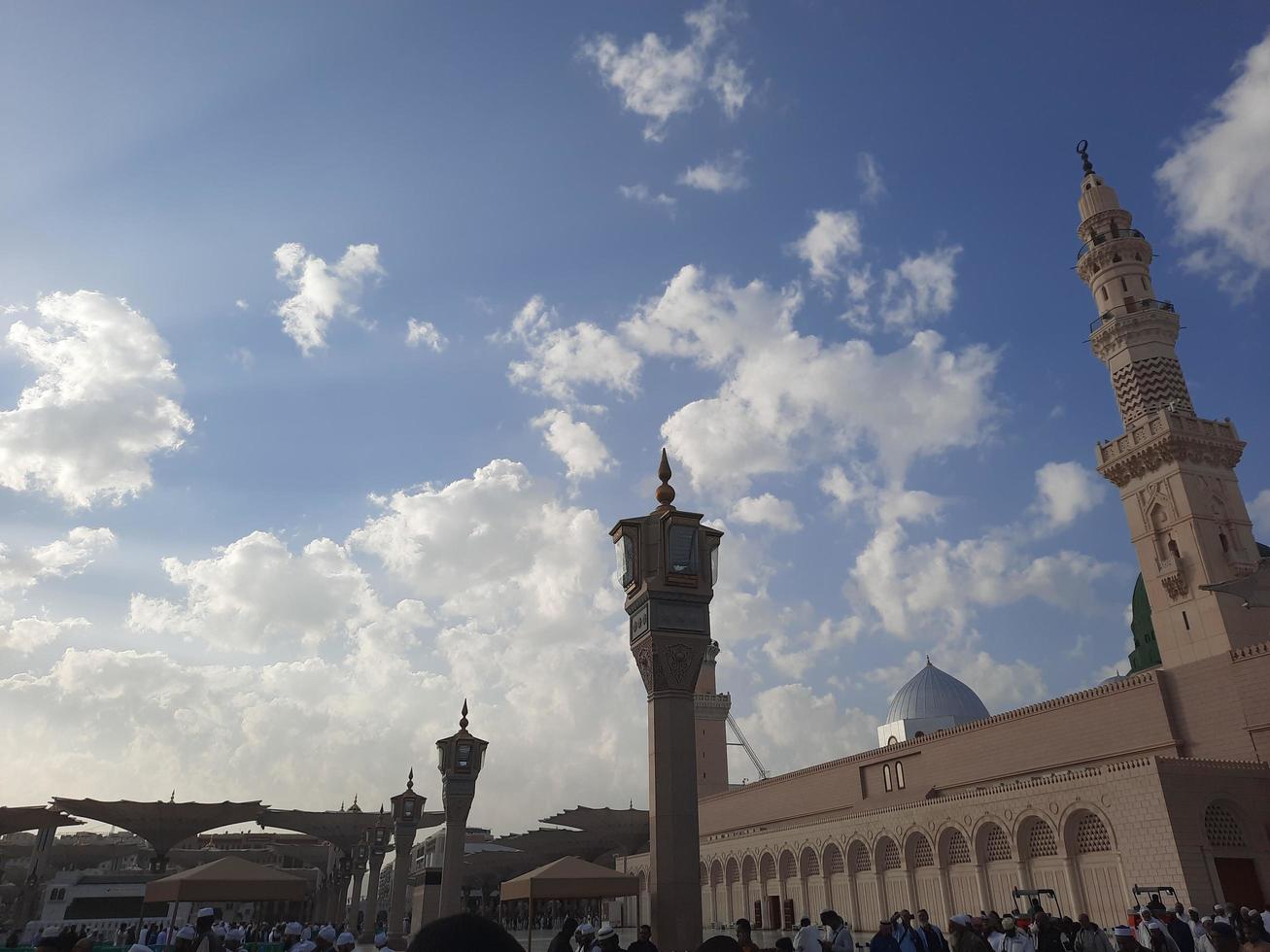 Medina, Saudi Arabia, Dec 2022 - During the day pilgrims from all over the world gather in the outer courtyard of Masjid Al Nabawi, Madinah, Saudi Arabia. photo